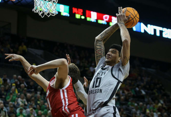 Oregon center Kel'el Ware drags down a rebound as the Oregon Ducks host Wisconsin in the quarterfinal round of the NIT Tuesday, March 21, 2023 at Matthew Knight Arena in Eugene, Ore.